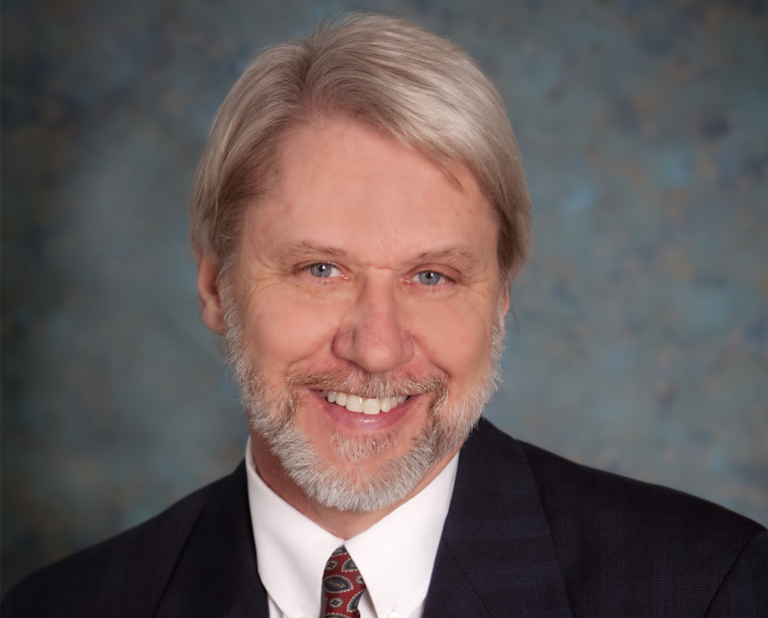 Prof. Barry Floyd pictured from the shoulders wearing a suit and tie.