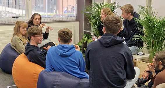 Students on bean bags having a group chat