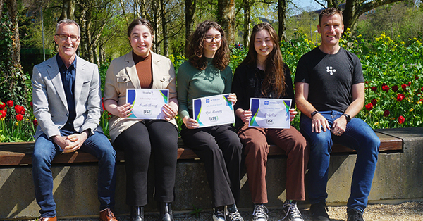 John Burton from Transact Campus presents Pardis Norouzi with her ISE scholarship and Des Traynor of Intercom presents Emily Roys and Rosie Kennelly